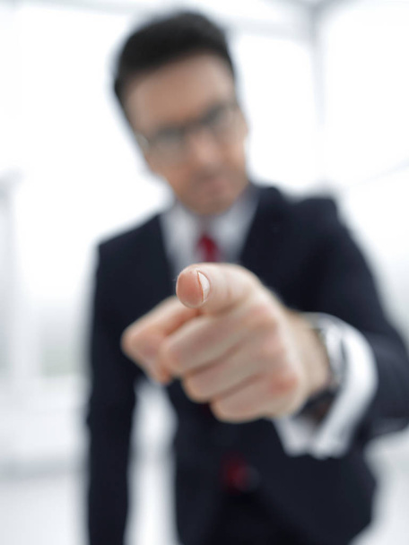 background image of a businessman pointing his finger at you - 写真・画像