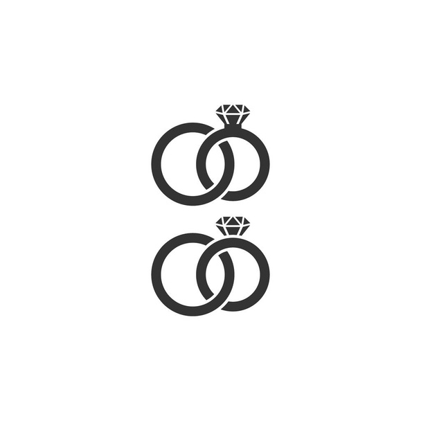 Deux anneaux de mariage icône vectorielle. Des alliances en diamant. Anneaux de mariée et marié enchevêtrés icônes isolées noires
. - Vecteur, image