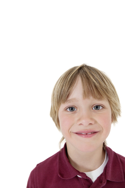 Close-up portrait of a school boy over white background - Фото, изображение