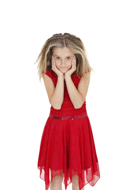 Portrait of girl in red frock with head in hands over white background - Fotografie, Obrázek