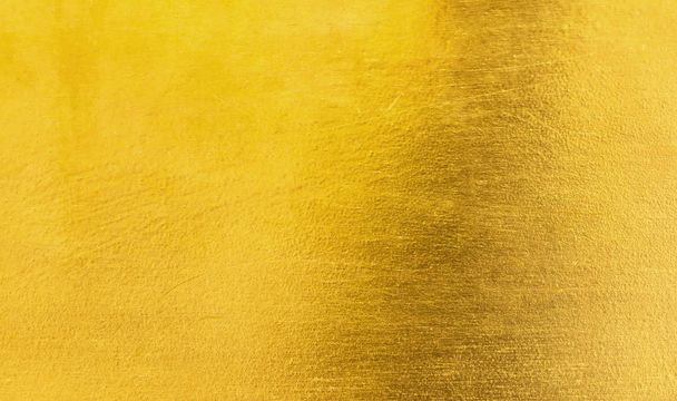 Lesklé žluté listí zlaté fólie texturu pozadí / zlatý kov kartáčovaný pozadí nebo textury - Fotografie, Obrázek