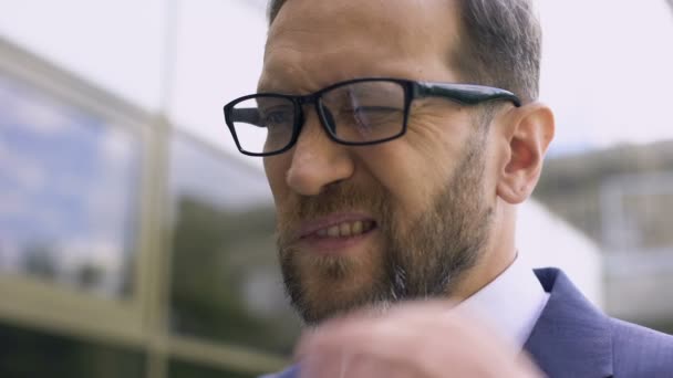 Male eyeglasses has ear pain, bacterial infection, inflammation, otitis disease - Felvétel, videó