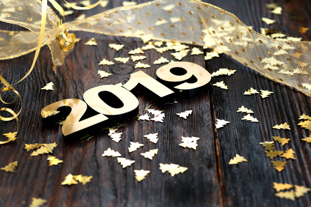 Happy New Year 2019. Symbol from number 2019 on wooden background - Photo, Image