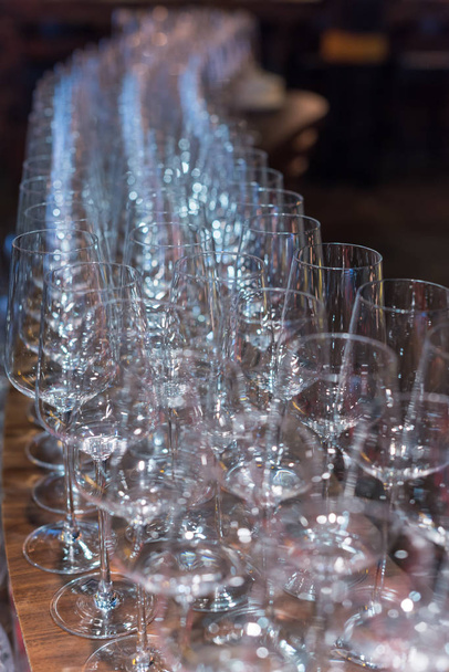 Empty wine glasses in a row selective focus - Zdjęcie, obraz