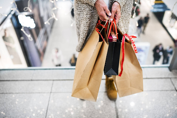 Senior woman with bags doing Christmas shopping. - Foto, Imagen
