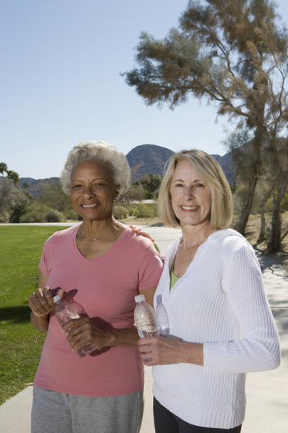 Senior Women With Bottles Of Mineral Water - Foto, imagen