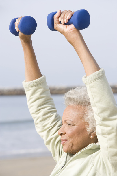 Senior Woman Exercising With Dumbbells - Foto, Imagen