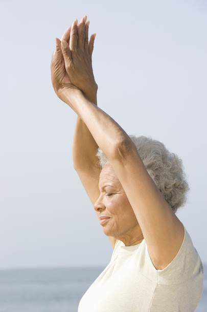 Senior Woman With Eyes Closed In Yoga Pose - Фото, зображення