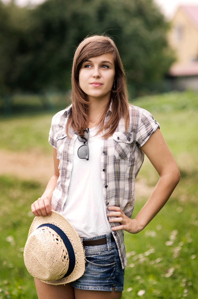Beauty young woman with fedora hat in hand - Foto, immagini