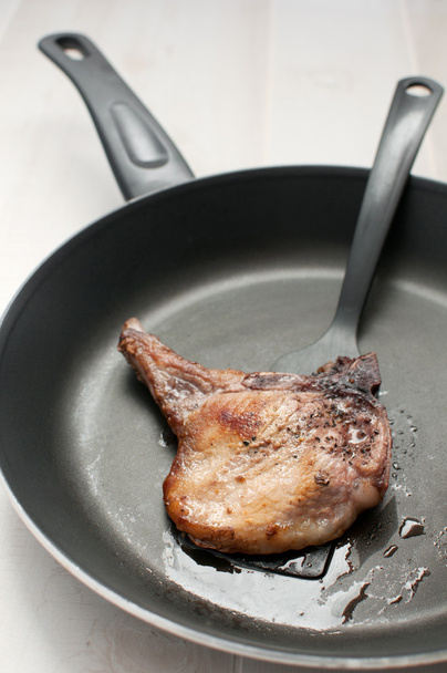 Frying pan with meat piece top view - Photo, Image