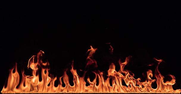 Texture of fire on a black background. - Photo, image