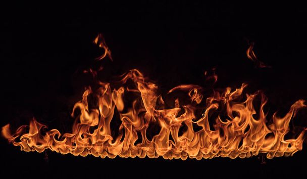 Texture of fire on a black background. - Zdjęcie, obraz