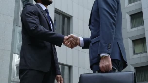 Future business partners shaking hands slow-mo, company cooperation, teamwork - Footage, Video