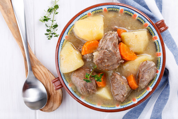 Meat stew with potatoes and carrots. Goulash soup. Top view. - Photo, Image