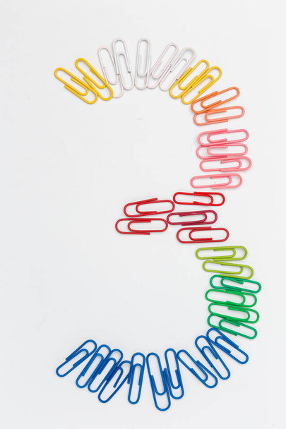 Number three made from color rainbow paper clips on white - 写真・画像