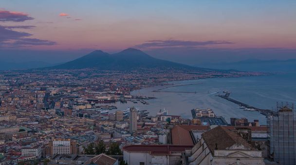 A picture of Naples featuring Mount Vesuvius in the distance, at sunset. - Photo, Image