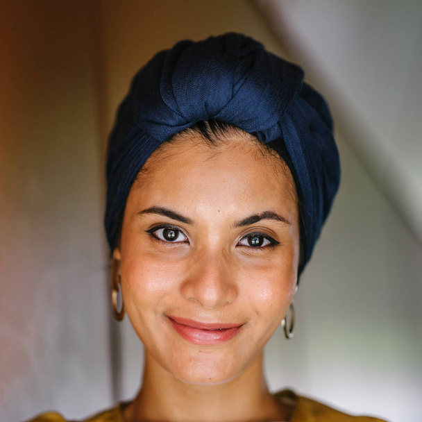 Portrait of a young Muslim woman wearing a turban (headscarf, hijab). She is elegant and  attractive - Photo, image