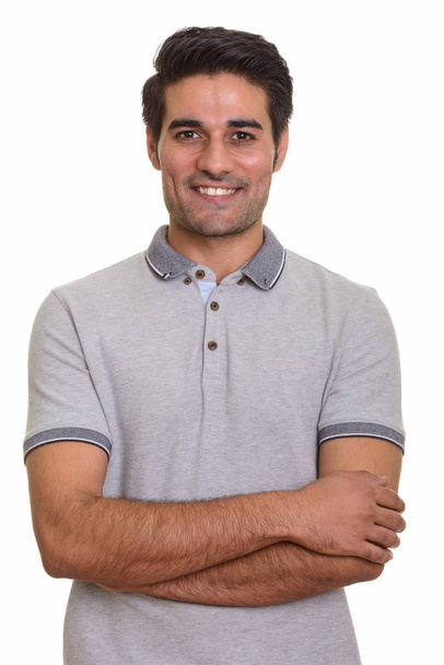 Young handsome Persian man against white background - Photo, Image