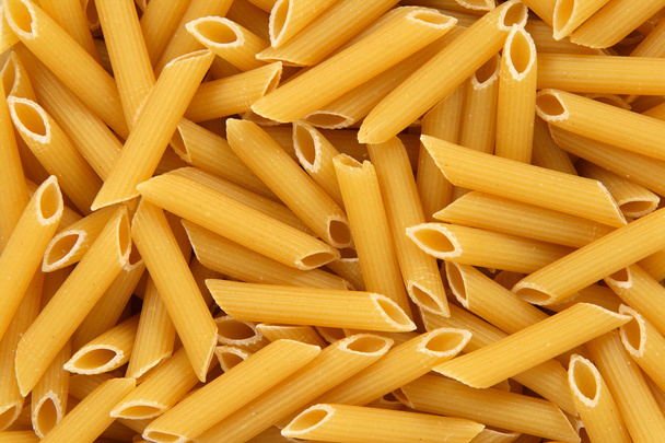 penne rigate pasta achtergrond - Foto, afbeelding