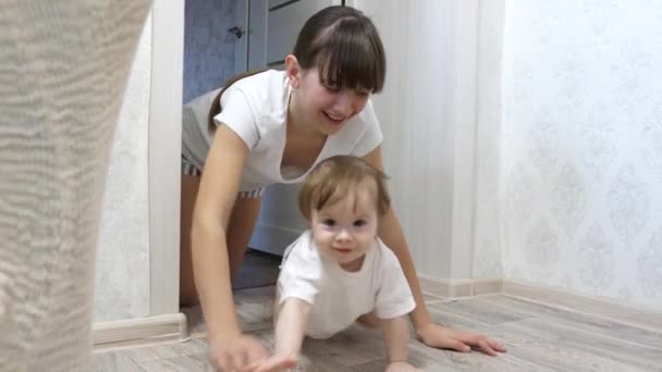 Mom plays with her child in the children room. - 映像、動画