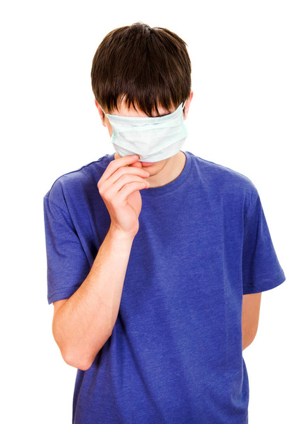 Young Man hide his Face with a Flu Mask Isolated on the White Background - Foto, afbeelding