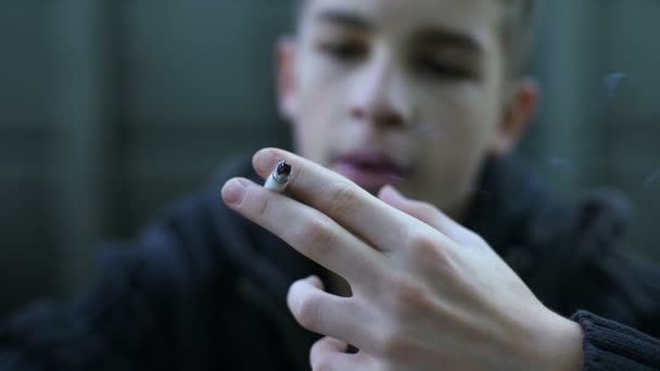 Schoolboy smoking, protest against parental control, bad influence of street - Felvétel, videó