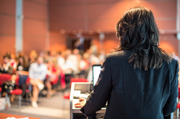 Female public speaker giving talk at Business Event. - Photo, Image