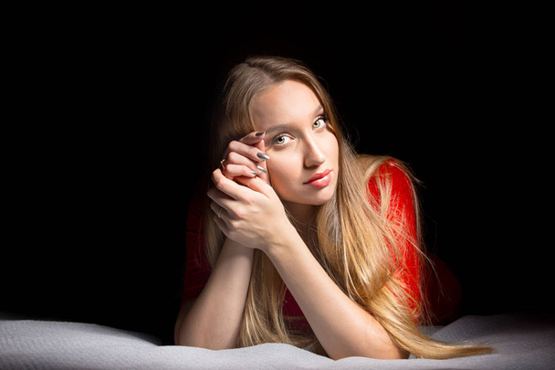 Portrait of a beautiful blonde girl with long hair. Emotions thinking and calm mood. Pretty woman. - Foto, Bild
