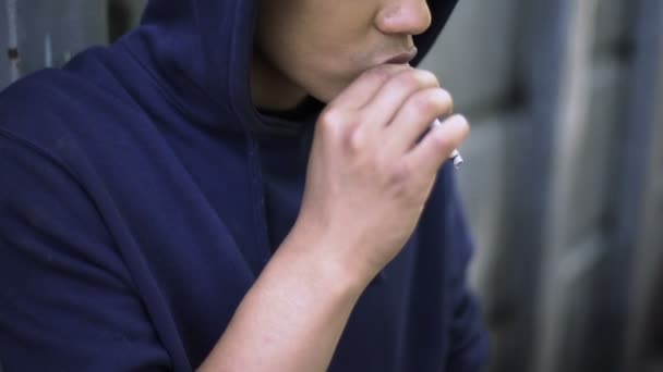 Depressed teenager smoking tobacco to relax, addiction problem, family crisis - Video, Çekim
