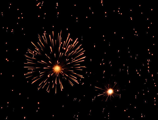 Fireworks exploding in black sky full of sparkles - Photo, Image