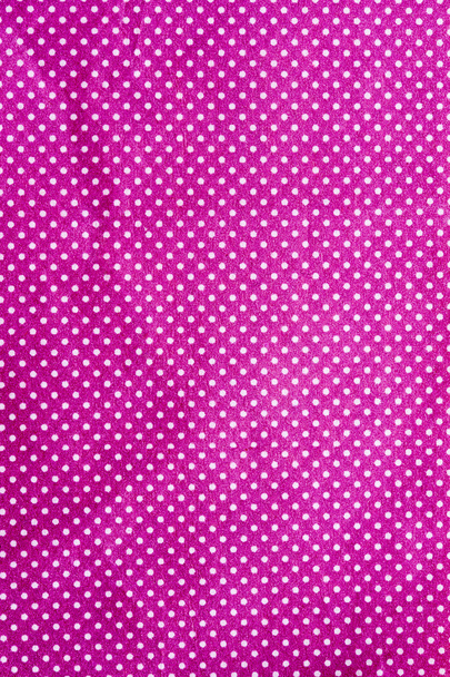 Морщинистая фиолетовая ткань с белой точкой
 - Фото, изображение