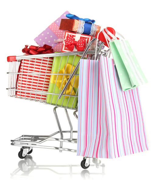 Christmas gifts and shopping in trolley isolated on white - Foto, afbeelding
