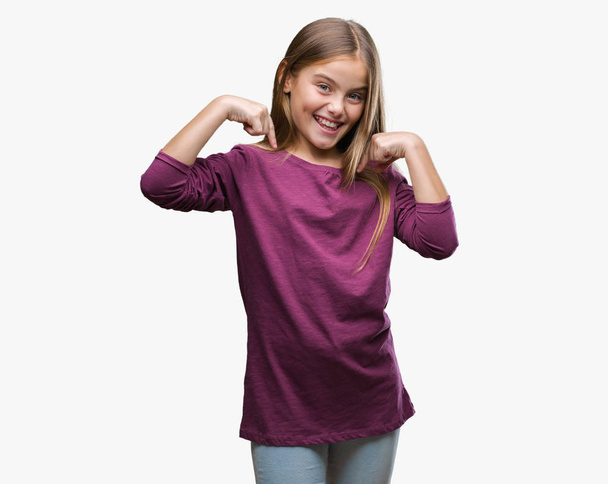 Young beautiful girl over isolated background looking confident with smile on face, pointing oneself with fingers proud and happy. - Photo, Image
