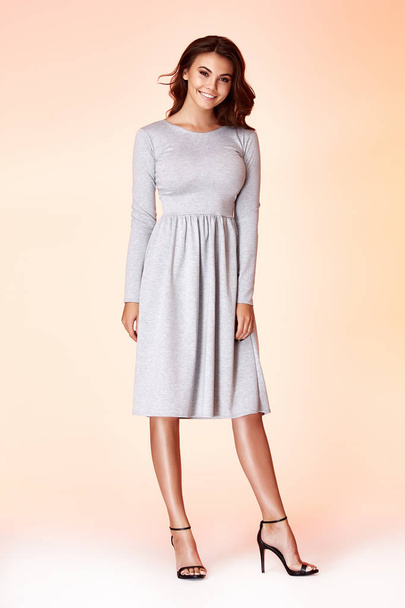 Beauty woman model wear stylish design trend clothing natural organic wool cotton grey dress casual formal office style for work meeting walk party brunette hair makeup. - Fotó, kép