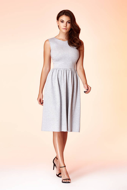 Beauty woman model wear stylish design trend clothing natural organic wool cotton grey dress casual formal office style for work meeting walk party brunette hair makeup. - 写真・画像