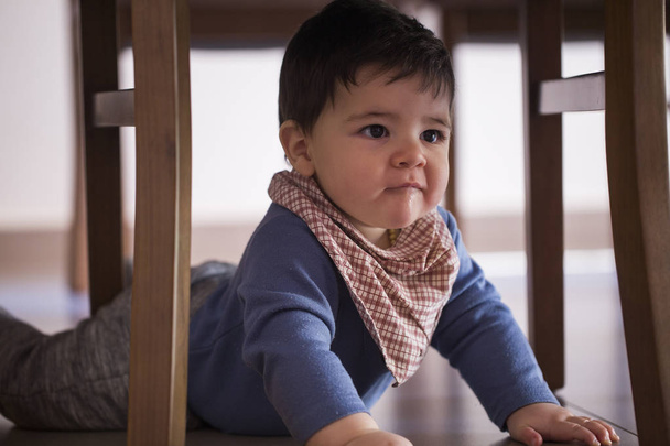 beautiful baby boy under the table. - Photo, Image