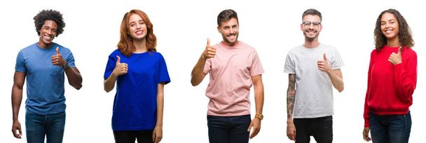 Composition of african american, hispanic and caucasian group of people over isolated white background doing happy thumbs up gesture with hand. Approving expression looking at the camera with showing success. - Valokuva, kuva