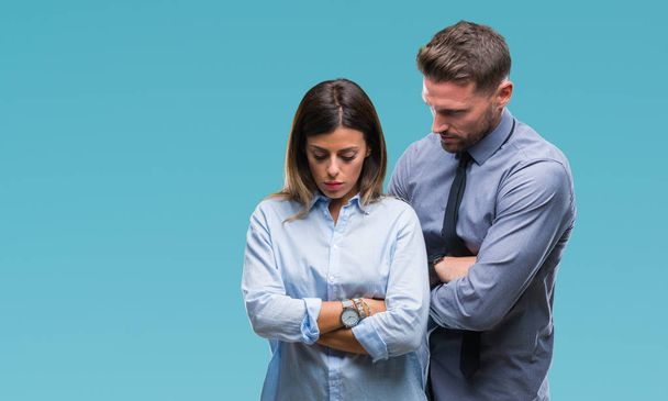 Young workers business couple over isolated background skeptic and nervous, disapproving expression on face with crossed arms. Negative person. - Photo, Image