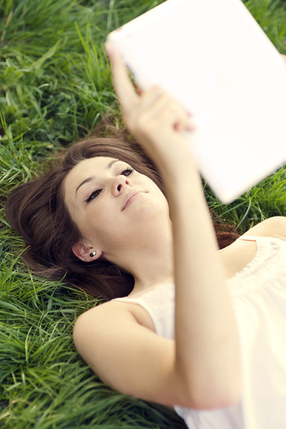 Young woman using digital tablet - Photo, Image