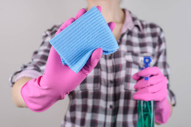 Checkered shirt housekeeping housecleaning person people microfiber duster camera concept. Close up photo of lady's hands wiping transparent glass using sprayer isolated on gray background - Фото, изображение