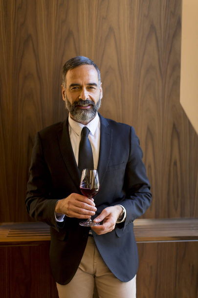 Portrait of handsome man with glass of red wine - Fotografie, Obrázek