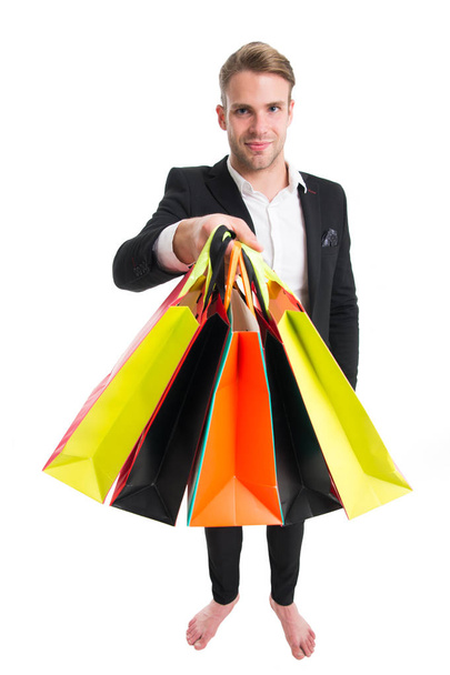 big sale in shopping mall. Cyber Monday and black Friday concept. Positive man enjoying shopping. Excited young man doing online shopping. Nice purchase. Heavy bags. Choosing the best. Shopaholic - Fotó, kép