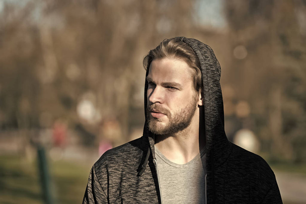 man in hood sunny outdoor, sport fashion - Fotoğraf, Görsel