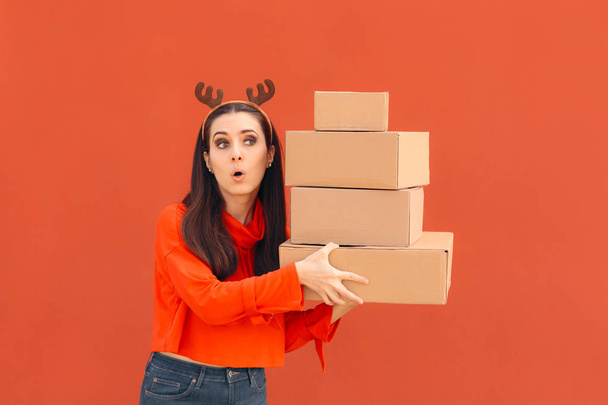 Christmas Delivery Girl Holding Many Packages  - 写真・画像