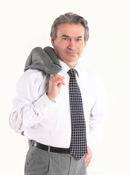 confident businessman holding a jacket over his shoulder .isolated on white background - Φωτογραφία, εικόνα
