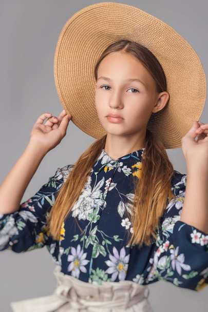 child in the Studio posing in fashionable clothes - Photo, Image