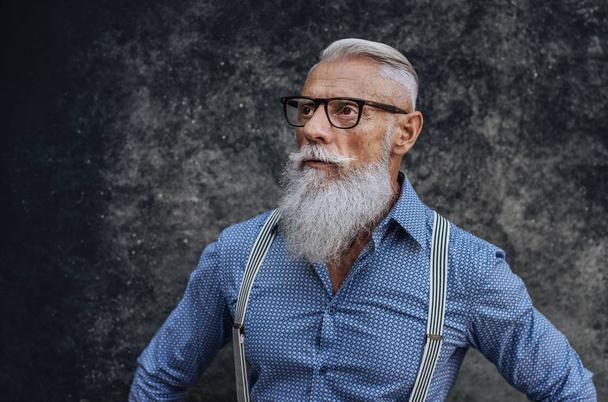 Handsome senior man portrait - Youthful and stylish man in the sixties, concepts about lifestyle, seniors and business - Photo, image