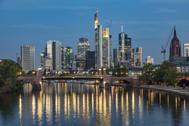 skyline of Frankfurt am Main reflecting in river Main in early morning - Photo, image