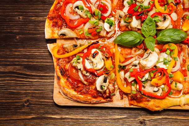 Italian pizza on wooden board - 写真・画像