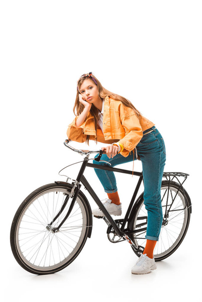 tired hipster girl sitting on bicycle isolated on white - Foto, Imagem